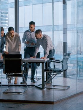 Startup business: mature people in suits discussing new projects in office