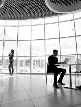 Two businessmen and businesswoman working in office