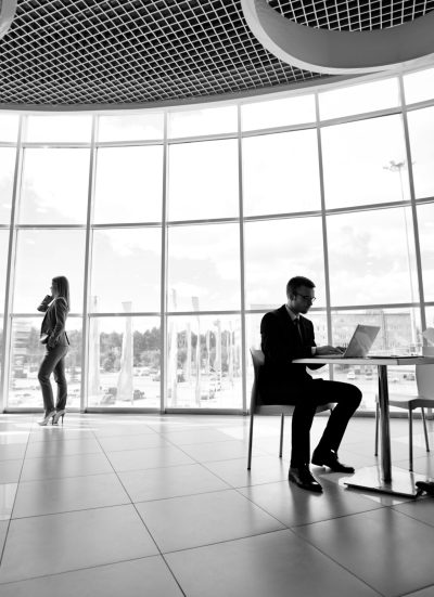 Two businessmen and businesswoman working in office